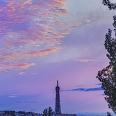 A pink and purple sunset behind Eiffel Tower