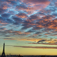 The Eiffel Tower and l’Arc de Triomphe at sunset.