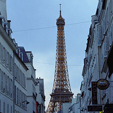 The Eiffel Tower and rue Saint-Dominique at night.