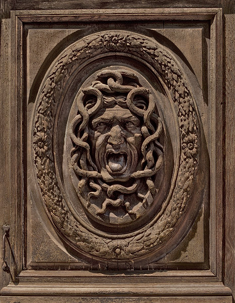 A Medusa head on a door of the hôtel Amelot de Bisseuil.