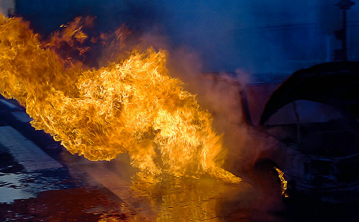 Flames gushing from a car on fire on quai du Louvre.