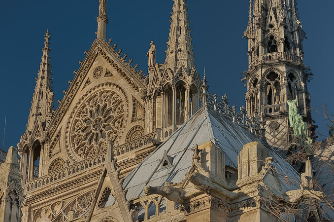 The rose window and spire on Notre-Dame’s southern facade