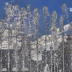 Notre-Dame Cathedral seen behind a fountain next to l’Hôtel de Ville.