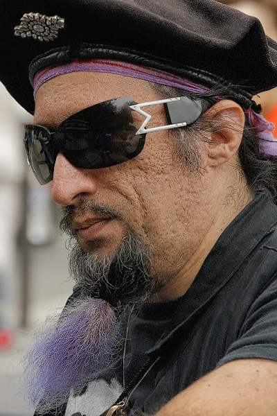 A man with a purple beard on île de la Cité.