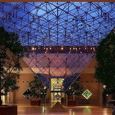 The Carrousel du Louvre’s Inverted Pyramid at night.