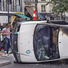 An RATP van turned on its side and burned near Barbès-Rochechouart during protests against Israeli attacks on the Gaza Strip.