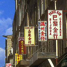 Signs for Asian businesses on rue de Belleville.