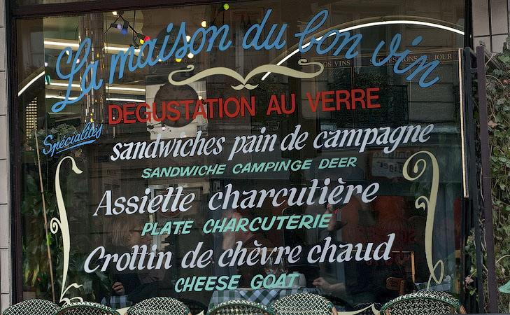 Amusing translation mistakes on a Parisian restaurant window: Cheese goat.