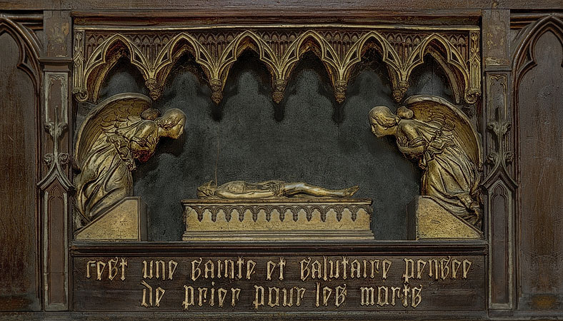 Sculptures and a citation from the Bible in a chapel inside Église Saint-Merry.