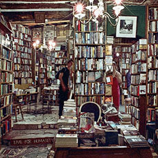 The interior of Shakespeare and Company at night.