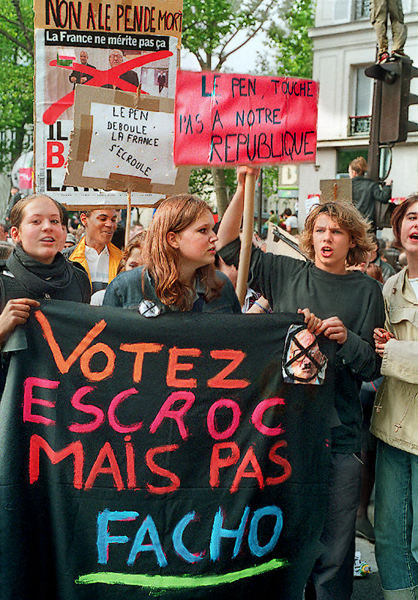 Teenagers protesting against the Front National on boulevard Richard-Lenoir with a banner reading «Votez escroc mais pas facho».