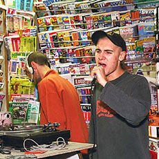 A rapper singing with DJs on rue de Belleville.