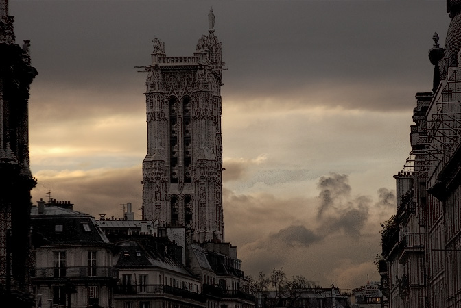 The Saint-Jacques Tower and rue de Rivoli at sunset.