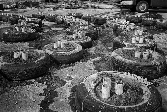 Certainly the concentric circles were inspired by the shape and form of the tires themselves and the easiest way of spreading them out so they could be filled with concrete.