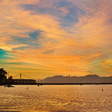 A sunset over San Francisco Bay and the Marin Mountains.