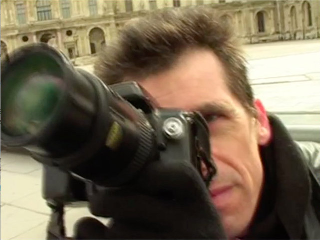 David Henry taking pictures of the Grande Pyramide du Louvre.