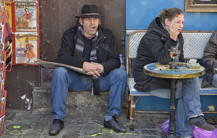 A street artist rotating his dentures in place du Tertre, Montmartre.