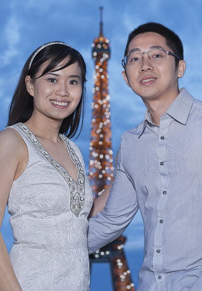 A portrait taken in front of the Eiffel Tower.