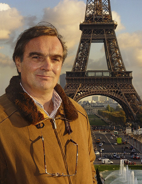 A portrait taken in front of the Eiffel Tower.