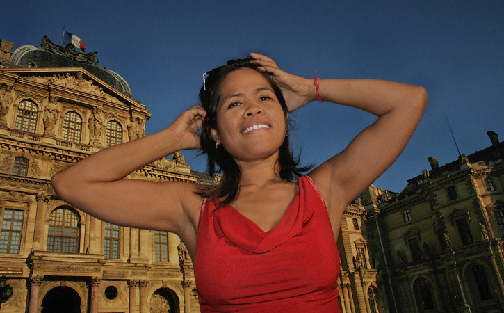 A portrait taken in the courtyard of the Louvre museum.