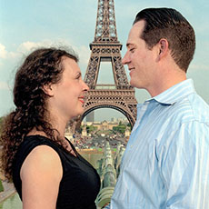 Michael Dolan and Irina posing in front of the Eiffel Tower, about 90 minutes before he proposed mariage on the Eiffel Tower.